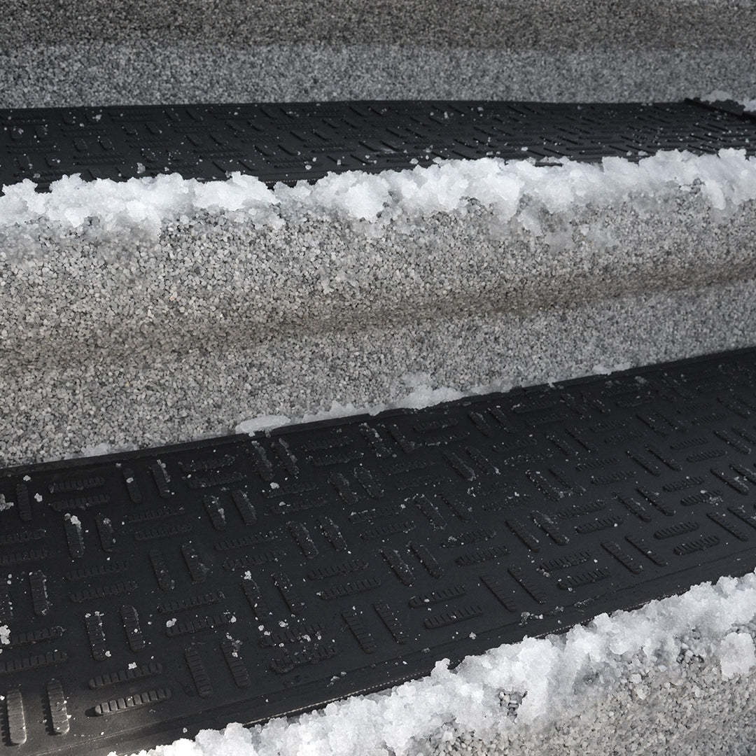 Snow melting mat installation on residential walkway